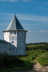 Fototapeta premium Mill tower and fortress wall in Spaso-Prilutsky Monastery, Vologda, Russia