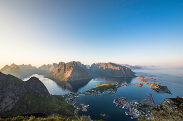 Naklejka na ściany i meble Beautiful scenery of Reine on top of Reinebringen during sunset time on a clear summer day, Lofoten Islands, North Norway
