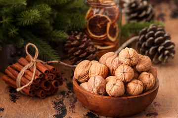 Christmas background walnuts ,dry oranges and cinnamon sticks 