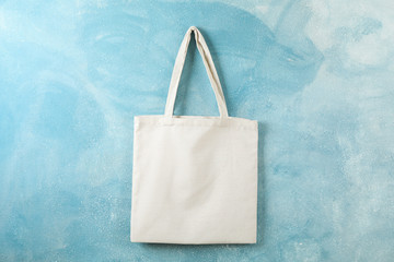 Tote cotton bag on color wall, space for text