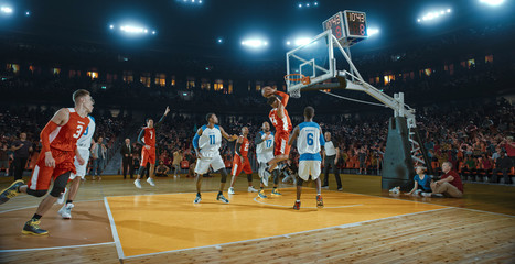 Basketball players on big professional arena during the game. Tense moment of the game. Celebration - Powered by Adobe