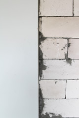 White aerated brick wall, white lightweight concrete block texture background.