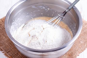 Flour in a bowl with dough