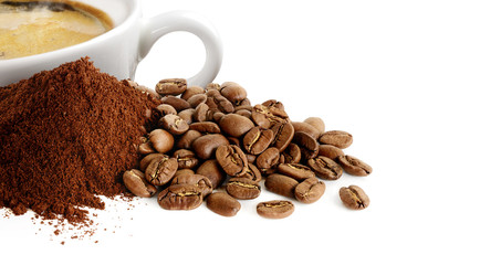Pile of coffee powder, coffee beans and cup of espresso isolated on white