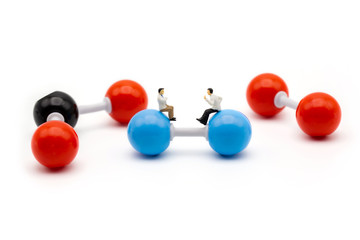 Miniature scientist observing and discussing on molecular structure and bonding of nitrogen carbon dioxide and oxygen 