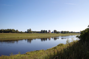 by the river on a clear summer day