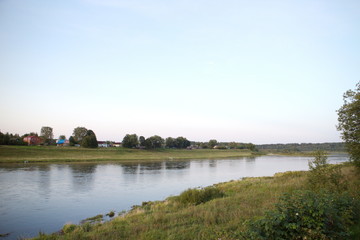 Fototapeta na wymiar by the river in the countryside on a summer evening