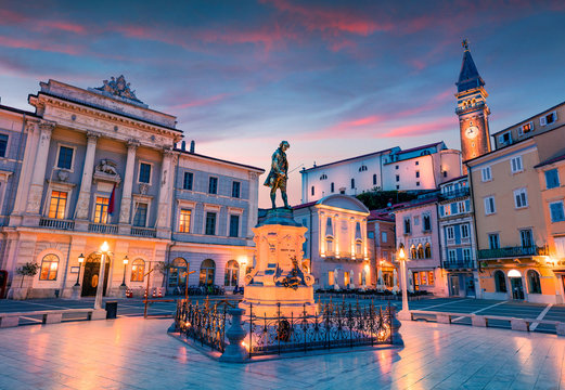 Impressive night view of Tartini Square in old town Piran. Splendid spring sunset in Slovenia, Europe. Traveling concept background. Beautiful Mediterranean cityscape.