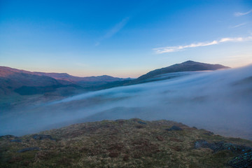 Fototapeta na wymiar Fog on the Valley in the Evening, Lake District, UK, 2015