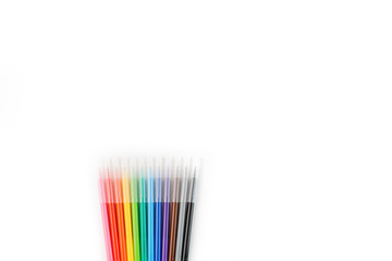 Multi-colored felt-tip pens, markers on a white isolated background