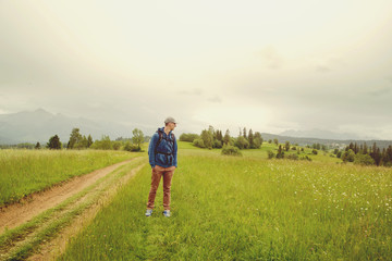 Traveler Man with backpack mountaineering