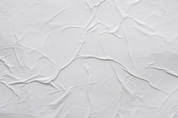 Blank white crumpled and creased paper poster texture background