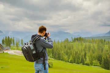 Nature photographer taking photos in the mountains