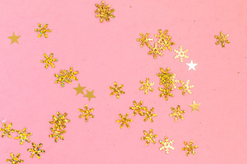 Shiny gold snowflakes pattern on bright pink background, Christmas greeting card design template with space for text