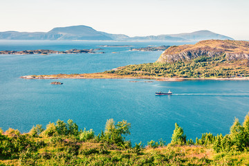 Fototapeta premium From the bird's eye view of Alesund bay, Geirangerfjord, Norway. Nice summer scene of the Nord. Traveling concept background. Instagram filter toned.