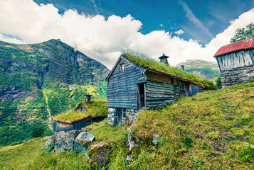 Norwegian typical grass roof wooden old house. Colorful morning scene in Norway, Europe. Beauty of countryside concept background. Instagram filter toned.