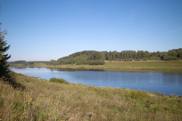 by the river on a clear summer day