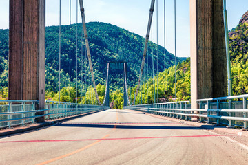 Typical Norwegian view of the bridge across the fjord. Colorful summer morning in the Norway....