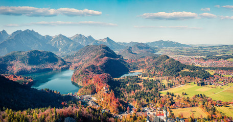 Aerial autumn panorama of Alterschrofen village in Fussen Germany. Sunny morning panorama of Bavarian Alps, Germany, Europe. Traveling concept background.