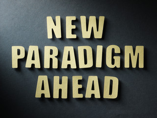 The word New Paradigm Ahead on paper background