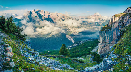 Unbelievable summer view of Gruppo Del Cristallo mountain range in Tre Cime Di Lavaredo national park. Spectacular morning scene of Dolomite Alps, Italy, Europe. Beauty of nature concept background.