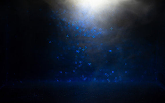 Light and shadow, blue sparkling texture on a black background