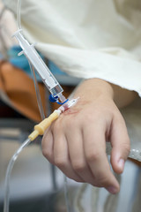 intravenous injection to the child. Hand of a child with a needle. Intravenous infusion system