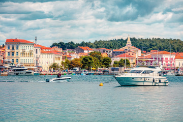 Sunny morning cityscape of popular summer resort Porec. Beautiful spring seascape of Adriatic Sea. Bright  scene of Istrian Peninsula in western Croatia, Europe. Instagram filter toned.