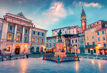 Fantastic evening view of Tartini Square in old town Piran. Splendid spring sunset in Slovenia, Europe. Traveling concept background. Beautiful Mediterranean cityscape.