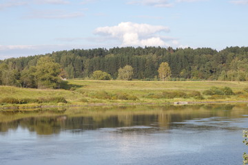 River banks and sky with cumulus clouds