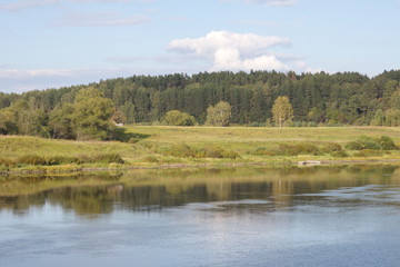 River banks and sky with cumulus clouds