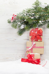 Fototapeta na wymiar Christmas gift boxes and xmas fir tree