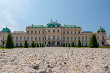 Fototapeta na wymiar Upper Belvedere Palace with the pond is one of the most beautiful baroque palaces in Europe, Vienna, Austria. popular touristic attraction with famous museum and beautiful park with pond
