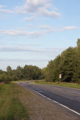 Fototapeta premium road in the countryside on a summer evening