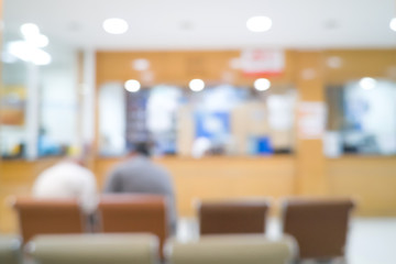Two men patiens waiting at Pharmacy. Blured background of healthcare. Hospital hall.