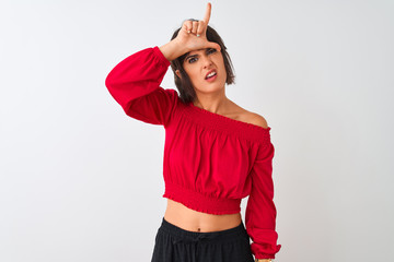 Young beautiful woman wearing red summer t-shirt standing over isolated white background making fun...