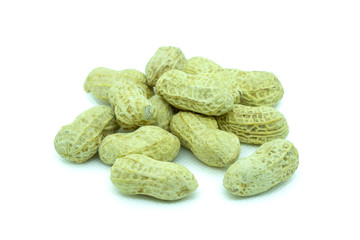 Organic peanuts in a shell on a white background A close up of peanuts