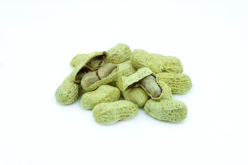 Organic peanuts in a shell on a white background A close up of peanuts