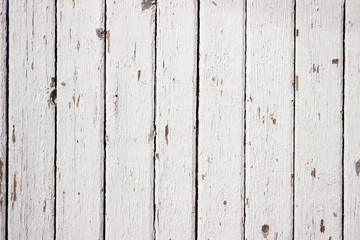 White wood background. Scratched white paint on a wooden plank wall. Background, texture