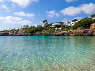Clean transparent sea water near Esmeralda beach of Mallorca island in summertime in a sunny day