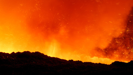 Naklejka premium molten iron flows out of the blast furnace