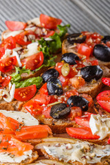 Assorted bruschetta Set of various appetizing snacks sandwiches