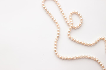 Pearls on white background