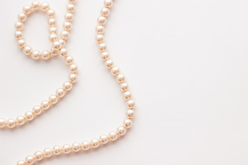 Pearls on white background