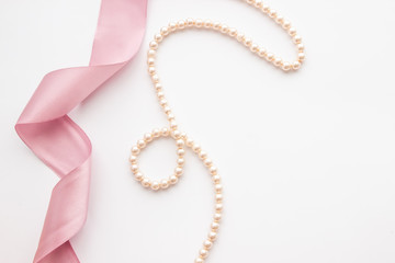 Feminine desktop mockup with pearls and pink ribbon