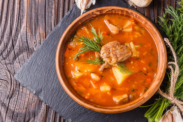 Chanahi a traditional Georgian meat stew in a bowl on stoyn board