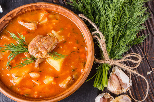 Chanahi a traditional Georgian meat stew in a bowl on stoyn board