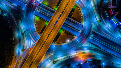 Aerial view Expressway motorway highway circus intersection at Night time Top view , Road traffic in city at thailand.