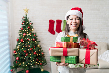 Happy Woman With Heap Of Christmas Presents