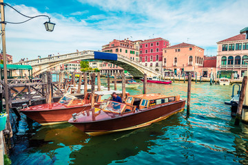 Fototapeta na wymiar Bright spring view of Vennice with famous water canal and Scalzi Bridge. Splendid morning scene of Italy, Europe. Magnificent Mediterranean cityscape. Traveling concept background.